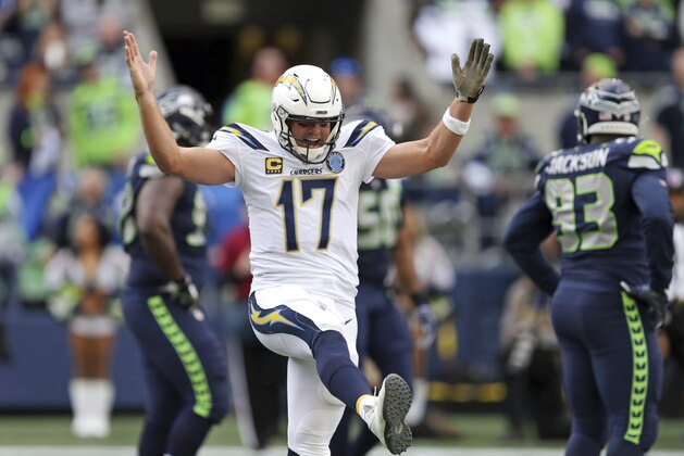 Los Angeles Chargers quarterback Philip Rivers celebrates a touchdown by the team against the Seattle Seahawks during the first half of an NFL football game, Sunday, Nov. 4, 2018, in Seattle. (AP Photo/Scott Eklund)