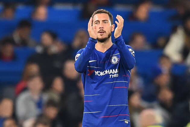 Chelsea's Belgian midfielder Eden Hazard applauds supporters on the pitch after the English Premier League football match between Chelsea and Crystal Palace at Stamford Bridge in London on November 4, 2018. - Chelsea won the game 3-1. (Photo by Glyn KIRK / AFP) / RESTRICTED TO EDITORIAL USE. No use with unauthorized audio, video, data, fixture lists, club/league logos or 'live' services. Online in-match use limited to 120 images. An additional 40 images may be used in extra time. No video emulation. Social media in-match use limited to 120 images. An additional 40 images may be used in extra time. No use in betting publications, games or single club/league/player publications. /         (Photo credit should read GLYN KIRK/AFP/Getty Images)