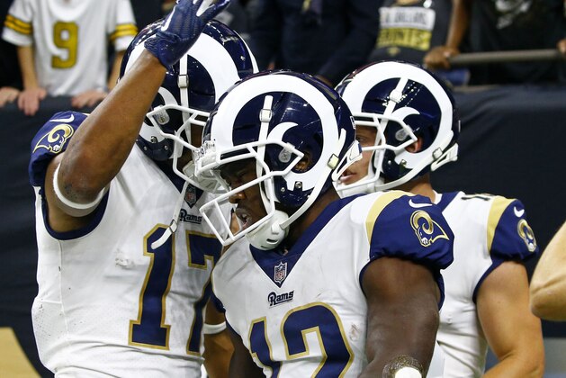 Los Angeles Rams wide receiver Brandin Cooks (12) celebrates his touchdown reception with wide receiver Robert Woods (17) in the first half of an NFL football game in New Orleans, Sunday, Nov. 4, 2018. (AP Photo/Butch Dill)