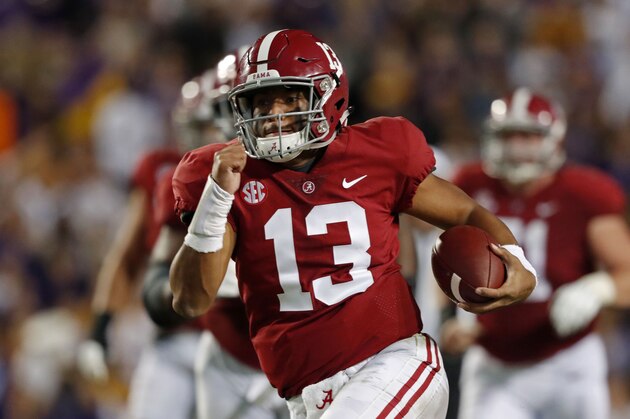 Alabama quarterback Tua Tagovailoa (13) rushes on a 44 yard touchdown carry in the second half of an NCAA college football game in Baton Rouge, La., Saturday, Nov. 3, 2018. Alabama won 29-0. (AP Photo/Gerald Herbert)