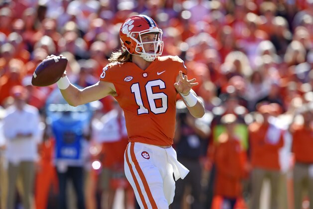 Clemson's Trevor Lawrence drops back to pass during the first half of an NCAA college football game against Louisville, Saturday, Nov. 3, 2018, in Clemson, S.C. (AP Photo/Richard Shiro)