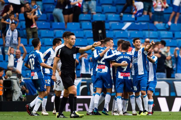 BARCELONA, SPAIN - AUGUST 26:  RCD Espanyol players celebrate the opening goal scored by their teammate Esteban Granero and conceded by referee Del Cerro Grande on advice from the Video Assistant Referee VAR during the La Liga match between RCD Espanyol and Valencia CF at RCDE Stadium on August 26, 2018 in Barcelona, Spain.  (Photo by Alex Caparros/Getty Images)