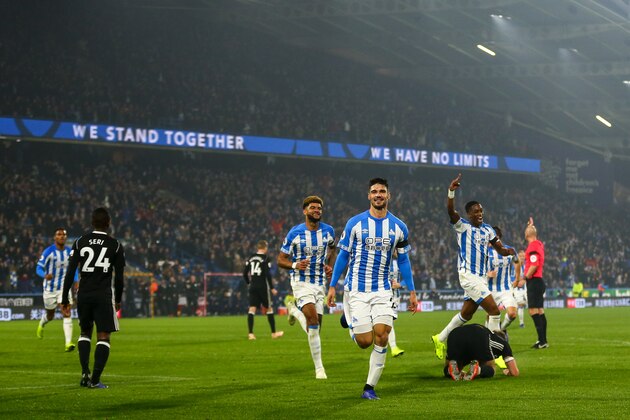 HUDDERSFIELD, ENGLAND - NOVEMBER 05: Christopher Schindler of Huddersfield Town celebrates after scoring a goal to make it 1-0  during the Premier League match between Huddersfield Town and Fulham FC at John Smith's Stadium on November 5, 2018 in Huddersfield, United Kingdom. (Photo by Robbie Jay Barratt - AMA/Getty Images)