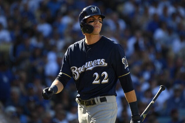 LOS ANGELES, CA - OCTOBER 17: Christian Yelich #22 of the Milwaukee Brewers reacts after striking out swinging during the third inning of Game Five of the National League Championship Series against the Los Angeles Dodgers at Dodger Stadium on October 17, 2018 in Los Angeles, California.  (Photo by Harry How/Getty Images)