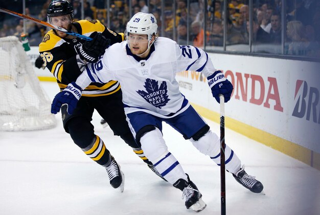 Boston Bruins' Kevan Miller (86) battles Toronto Maple Leafs' William Nylander (29) during the first period of Game 5 of an NHL hockey first-round playoff series in Boston, Saturday, April 21, 2018. The Maple Leafs won 4-3. (AP Photo/Michael Dwyer)