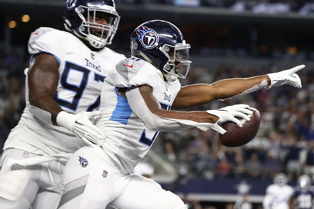 ARLINGTON, TX - NOVEMBER 05:  Darius Kilgo #97 and Kevin Byard #31 of the Tennessee Titans  celebrate the interception by Byard against the Dallas Cowboys in the first quarter of a football game at AT&T Stadium on November 5, 2018 in Arlington, Texas.  (Photo by Ronald Martinez/Getty Images)