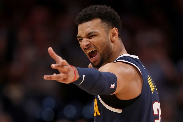 DENVER, CO - NOVEMBER 05:  Jamal Murray #27 of the Denver Nuggets celebrates a three point basket against the Boston Celtics in the fourth quarter at the Pepsi Center on November 5, 2018 in Denver, Colorado. NOTE TO USER: User expressly acknowledges and agrees that, by downloading and or using this photograph, User is consenting to the terms and conditions of the Getty Images License Agreement.  (Photo by Matthew Stockman/Getty Images)
