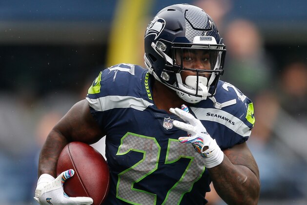SEATTLE, WA - OCTOBER 07: Running Back Mike Davis #27 of the Seattle Seahawks runs the ball in the first half against the Los Angeles Rams at CenturyLink Field on October 7, 2018 in Seattle, Washington. (Photo by Otto Greule Jr/Getty Images)