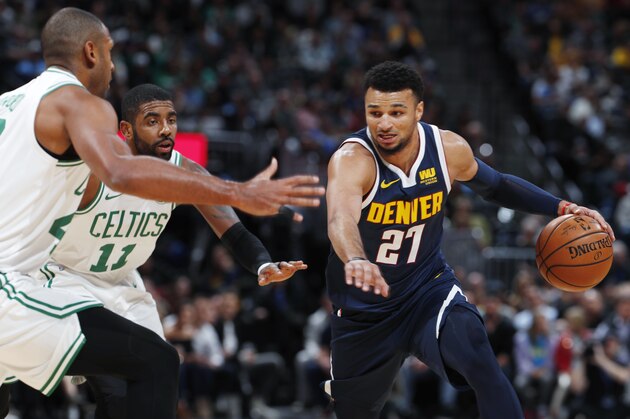 Denver Nuggets guard Jamal Murray, right, drives the lane as Boston Celtics center Al Horford, left, and guard Kyrie Irving, center, defend in the first half of an NBA basketball game Monday, Nov. 5, 2018, in Denver. (AP Photo/David Zalubowski)