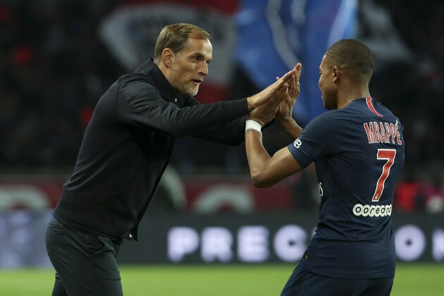 PARIS, FRANCE - OCTOBER 7: Kylian Mbappe of PSG celebrates his first goal with coach of PSG Thomas Tuchel during the french Ligue 1 match between Paris Saint-Germain (PSG) and Olympique Lyonnais (OL, Lyon) at Parc des Princes stadium on October 7, 2018 in Paris, France. (Photo by Jean Catuffe/Getty Images)