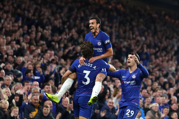 LONDON, ENGLAND - NOVEMBER 04:  Pedro of Chelsea celebrates with teammates Marcos Alonso and Alvaro Morata after scoring his team's third goal during the Premier League match between Chelsea FC and Crystal Palace at Stamford Bridge on November 4, 2018 in London, United Kingdom.  (Photo by Catherine Ivill/Getty Images)
