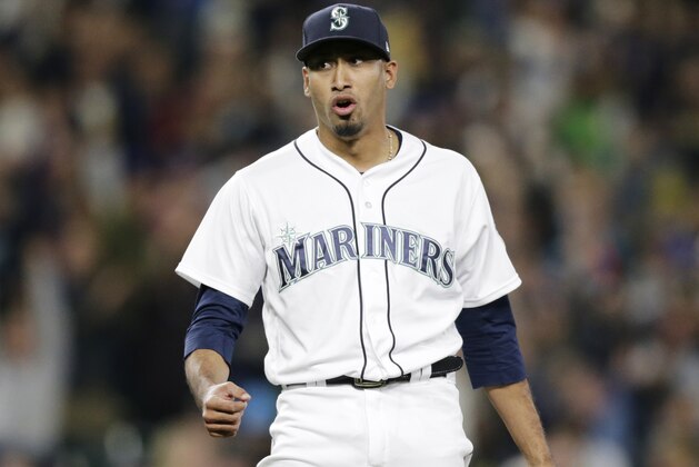 Seattle Mariners closing pitcher Edwin Diaz reacts after striking out Texas Rangers' Jurickson Profar with the bases loaded in the 4-1 win for the Mariners in a baseball game, Saturday, Sept. 29, 2018, in Seattle. (AP Photo/John Froschauer)