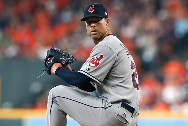 HOUSTON, TX - OCTOBER 05:  Corey Kluber #28 of the Cleveland Indians delivers a pitch in the second inning against the Houston Astros during Game One of the American League Division Series at Minute Maid Park on October 5, 2018 in Houston, Texas.  (Photo by Tim Warner/Getty Images)