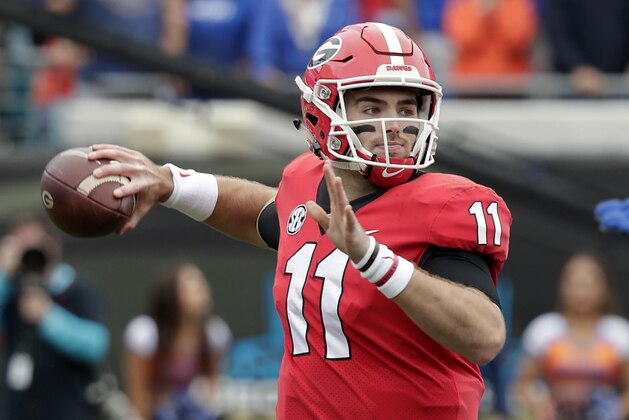 Georgia quarterback Jake Fromm (11) throws a pass against Florida during the first half of an NCAA college football game Saturday, Oct. 27, 2018, in Jacksonville, Fla. (AP Photo/John Raoux)