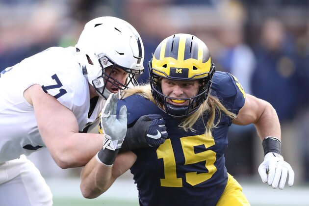 ANN ARBOR, MI - NOVEMBER 03: Chase Winovich #15 of the Michigan Wolverines rushes the quarterback as Will Fries #71 of the Penn State Nittany Lions makes the block during the first quarter of the game against at Michigan Stadium on November 3, 2018 in Ann Arbor, Michigan. Michigan defeated Penn State 42-7. (Photo by Leon Halip/Getty Images)