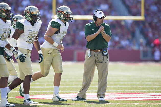 FAYETTEVILLE, AR - OCTOBER 25:  Head Coach Bill Clark of the UAB Blazers claps for his team as the run onto the field during a game against the Arkansas Razorbacks at Razorback Stadium on October 25, 2014 in Fayetteville, Arkansas.  The Razorbacks defeated the Blazers 45-17.  (Photo by Wesley Hitt/Getty Images)