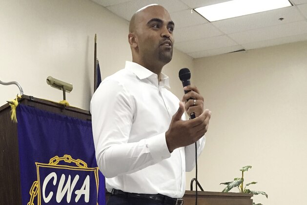 In this April 7, 2018 photo, Democratic congressional candidate Colin Allred, a former NFL linebacker and civil rights attorney, addresses a town hall in Dallas. The area has for years embodied country club Republicanism, but Allred is hoping that changing demographics and an electorate becoming better educated can help him upset longtime Republican Rep. Pete Sessions. If Democrats are going to retake the House in November, they may have to win in some unlikely places: Sessions' Dallas district, and similar Republican-held territory in Houston, Miami, Southern California and Cincinnati. (AP Photo/Will Weissert)