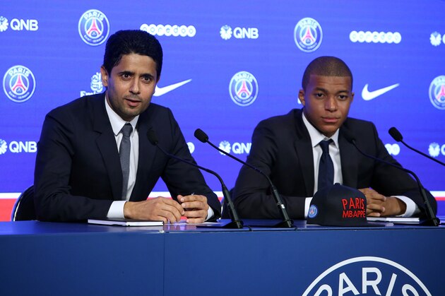 PARIS, FRANCE - SEPTEMBER 6: Kylian Mbappe is presented as new player of Paris Saint Germain by President of PSG Nasser Al Khelaifi at Parc des Princes on September 6, 2017 in Paris, France. (Photo by Jean Catuffe/Getty Images)