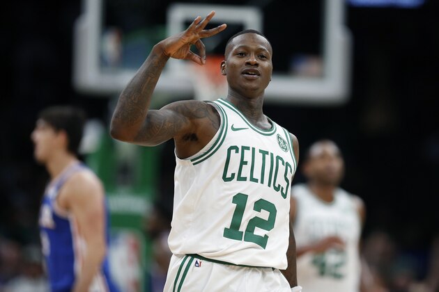 Boston Celtics' Terry Rozier celebrates his three-pointer during the second half of an NBA basketball game against the Philadelphia 76ers in Boston, Tuesday, Oct 16, 2018. (AP Photo/Michael Dwyer)