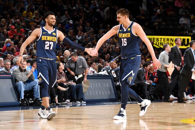 DENVER, CO - OCTOBER 29: Jamal Murray #27 and Nikola Jokic #15 of the Denver Nuggets high five during the game against the New Orleans Pelicans on October 29, 2018 at the Pepsi Center in Denver, Colorado. NOTE TO USER: User expressly acknowledges and agrees that, by downloading and/or using this photograph, user is consenting to the terms and conditions of the Getty Images License Agreement. Mandatory Copyright Notice: Copyright 2018 NBAE (Photo by Garrett Ellwood/NBAE via Getty Images)