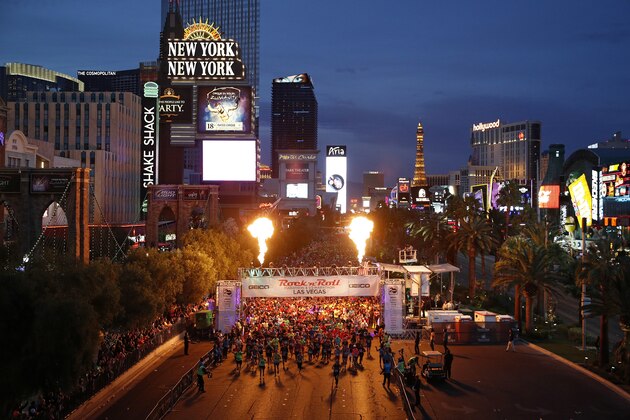 Runners start the Rock 'n' Roll Las Vegas Marathon along the Strip, Sunday, Nov. 12, 2017, in Las Vegas. (AP Photo/John Locher)