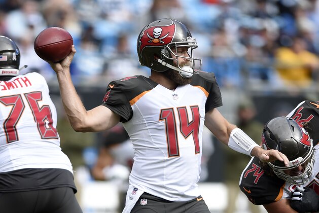 Tampa Bay Buccaneers' Ryan Fitzpatrick (14) looks to pass against the Carolina Panthers in the first half of an NFL football game in Charlotte, N.C., Sunday, Nov. 4, 2018. (AP Photo/Mike McCarn)