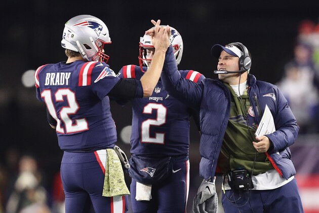 FOXBOROUGH, MA - NOVEMBER 04:  Tom Brady #12 of the New England Patriots high fives Brian Hoyer #2 and offensive coordinator Josh McDaniels during the second half against the Green Bay Packers at Gillette Stadium on November 4, 2018 in Foxborough, Massachusetts.  (Photo by Maddie Meyer/Getty Images)