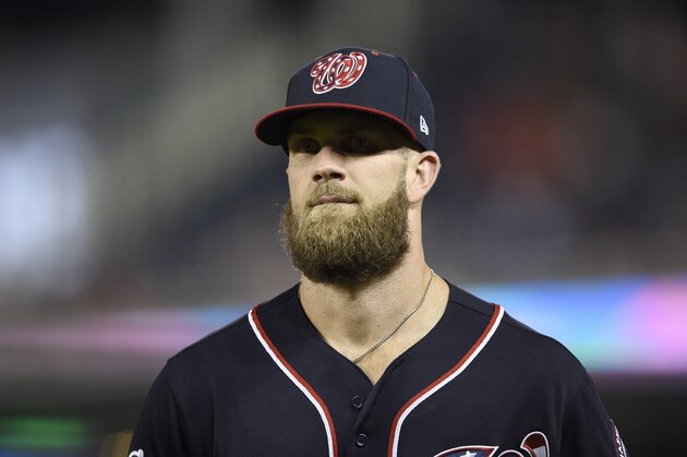 Washington Nationals' Bryce Harper stands on the field during a baseball game against the New York Mets, Friday, Sept. 21, 2018, in Washington. The Mets won 4-2. (AP Photo/Nick Wass)