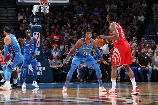 OKLAHOMA CITY, OK - NOVEMBER 8: James Harden #13 of the Houston Rockets looks to pass the ball during the game against Paul George #13 of the Oklahoma City Thunder on November 8, 2018 at Chesapeake Energy Arena in Oklahoma City, Oklahoma. NOTE TO USER: User expressly acknowledges and agrees that, by downloading and/or using this photograph, user is consenting to the terms and conditions of the Getty Images License Agreement. Mandatory Copyright Notice: Copyright 2018 NBAE (Photo by Zach Beeker/NBAE via Getty Images)