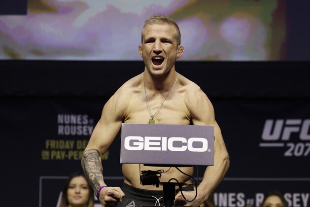 TJ Dillashaw poses during an event for UFC 207, Thursday, Dec. 29, 2016, in Las Vegas. (AP Photo/John Locher)