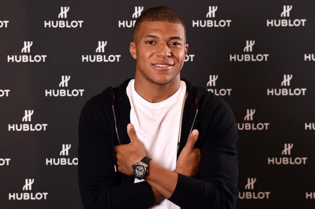 France's forward Kylian MBappe poses during a photo session after an interview with AFP in which he announced the formalization of his Ambassadorship with the Swiss luxury watchmaker Hublot on November 8, 2018. (Photo by FRANCK FIFE / AFP)        (Photo credit should read FRANCK FIFE/AFP/Getty Images)