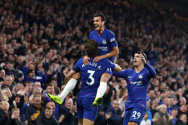 LONDON, ENGLAND - NOVEMBER 04:  Pedro of Chelsea celebrates with teammates Marcos Alonso and Alvaro Morata after scoring his team's third goal during the Premier League match between Chelsea FC and Crystal Palace at Stamford Bridge on November 4, 2018 in London, United Kingdom.  (Photo by Catherine Ivill/Getty Images)