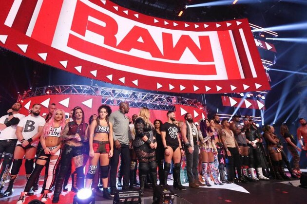 The Raw roster on the stage.