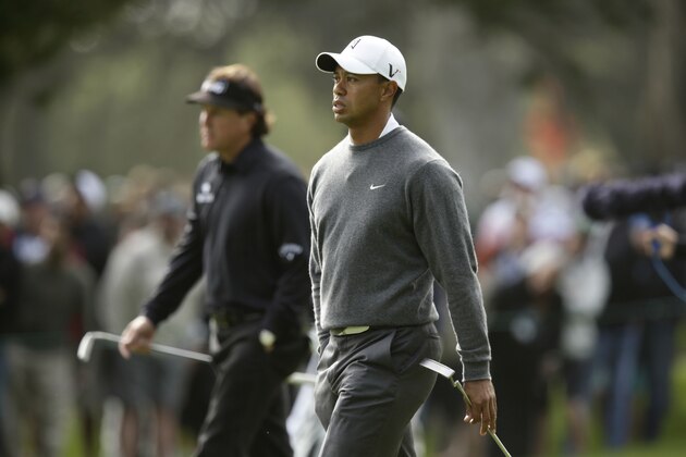Phil Mickelson and Tiger Woods during the first round of the U.S. Open Championship golf tournament Thursday, June 14, 2012, at The Olympic Club in San Francisco. (AP Photo/Charlie Riedel)