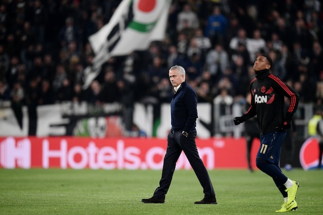 Manchester United's Portuguese manager Jose Mourinho (C) walks across the pitch next to Manchester United's French striker Anthony Martial prior to the UEFA Champions League group H football match Juventus vs Manchester United at the Allianz stadium in Turin on November 7, 2018. (Photo by Marco BERTORELLO / AFP)        (Photo credit should read MARCO BERTORELLO/AFP/Getty Images)