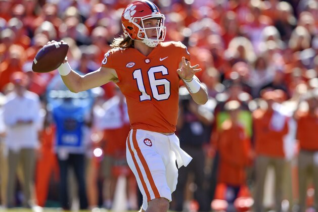 Clemson's Trevor Lawrence drops back to pass during the first half of an NCAA college football game against Louisville, Saturday, Nov. 3, 2018, in Clemson, S.C. (AP Photo/Richard Shiro)
