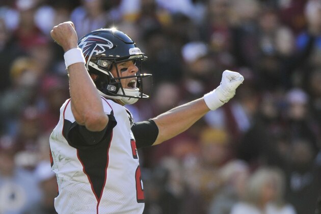 Atlanta Falcons quarterback Matt Ryan (2) celebrates running back Ito Smith's touchdown during the first half of an NFL football game against the Washington Redskins, Sunday, Nov. 4, 2018, in Landover, Md. (AP Photo/Mark Tenally)