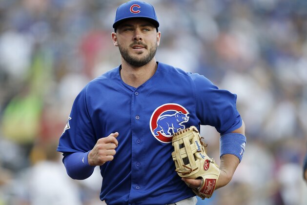 Chicago Cubs third baseman Kris Bryant runs into the clubhouse after warm ups before a baseball game aSan Diego Padres in San Diego, Saturday, July 14, 2018. (AP Photo/Alex Gallardo)