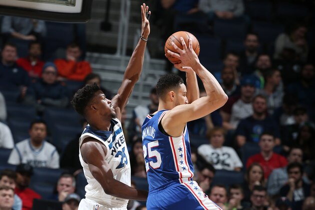 MINNEAPOLIS, MN - DECEMBER 12:  Ben Simmons #25 of the Philadelphia 76ers handles the ball against Jimmy Butler #23 of the Minnesota Timberwolves on December 12, 2017 at Target Center in Minneapolis, Minnesota. NOTE TO USER: User expressly acknowledges and agrees that, by downloading and or using this Photograph, user is consenting to the terms and conditions of the Getty Images License Agreement. Mandatory Copyright Notice: Copyright 2017 NBAE (Photo by David Sherman/NBAE via Getty Images)