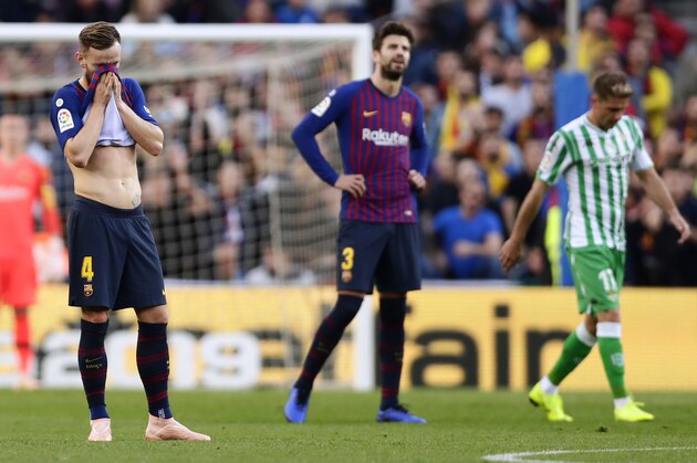 FC Barcelona's Ivan Rakitic gestures after Betis scores their side's second goal during the Spanish La Liga soccer match between FC Barcelona and Betis at the Camp Nou stadium in Barcelona, Spain, Sunday, Nov. 11, 2018. (AP Photo/Manu Fernandez)