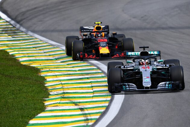 SAO PAULO, BRAZIL - NOVEMBER 11: Lewis Hamilton of Great Britain driving the (44) Mercedes AMG Petronas F1 Team Mercedes WO9 leads Max Verstappen of the Netherlands driving the (33) Aston Martin Red Bull Racing RB14 TAG Heuer on track during the Formula One Grand Prix of Brazil at Autodromo Jose Carlos Pace on November 11, 2018 in Sao Paulo, Brazil.  (Photo by Clive Mason/Getty Images)