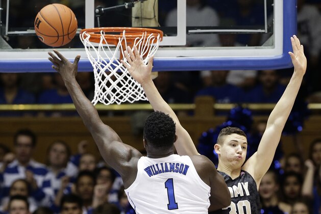 Duke's Zion Williamson (1) drives to the basket as Army's Ben Kinker (30) defends during the first half of an NCAA college basketball game in Durham, N.C., Sunday, Nov. 11, 2018. (AP Photo/Gerry Broome)