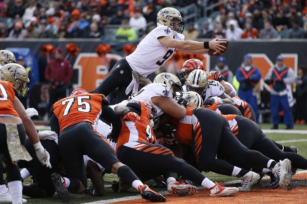 New Orleans Saints quarterback Drew Brees (9) dives in for a touchdown in the second half of an NFL football game, Sunday, Nov. 11, 2018, in Cincinnati. (AP Photo/Gary Landers)