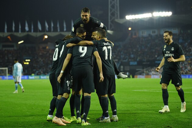 VIGO, SPAIN - NOVEMBER 11: Karim Benzema of Real Madrid celebrate with team mates after scores the second goal during the La Liga match between RC Celta de Vigo and Real Madrid CF at Abanca-Balaidos on November 11, 2018 in Vigo, Spain. (Photo by Octavio Passos/Getty Images)