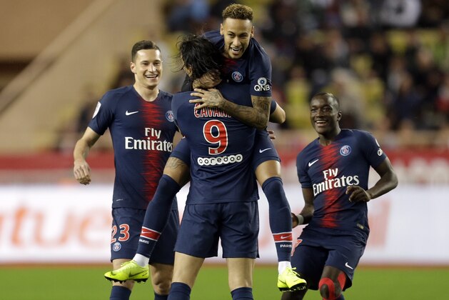 PSG's Edinson Cavani, center, celebrates with teammate Neymar, top center, after scoring his side's first goal of the game during the French League One soccer match between AS Monaco and Paris Saint-Germain at Stade Louis II in Monaco, Sunday, Nov. 11, 2018 (AP Photo/Claude Paris)
