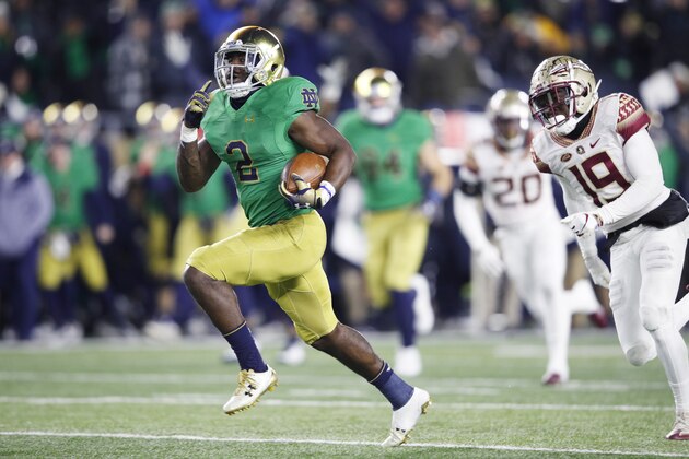 SOUTH BEND, IN - NOVEMBER 10: Dexter Williams #2 of the Notre Dame Fighting Irish breaks a tackle on his way to a 58-yard touchdown run against the Florida State Seminoles in the second quarter of the game at Notre Dame Stadium on November 10, 2018 in South Bend, Indiana. (Photo by Joe Robbins/Getty Images)
