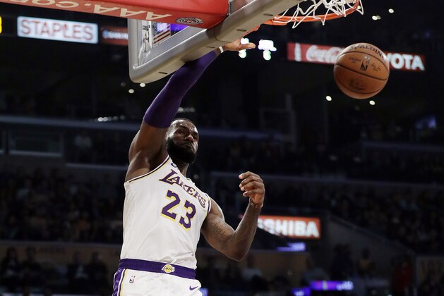 Los Angeles Lakers' LeBron James (23) dunks against the Atlanta Hawks during the first half of an NBA basketball game Sunday, Nov. 11, 2018, in Los Angeles. (AP Photo/Marcio Jose Sanchez)