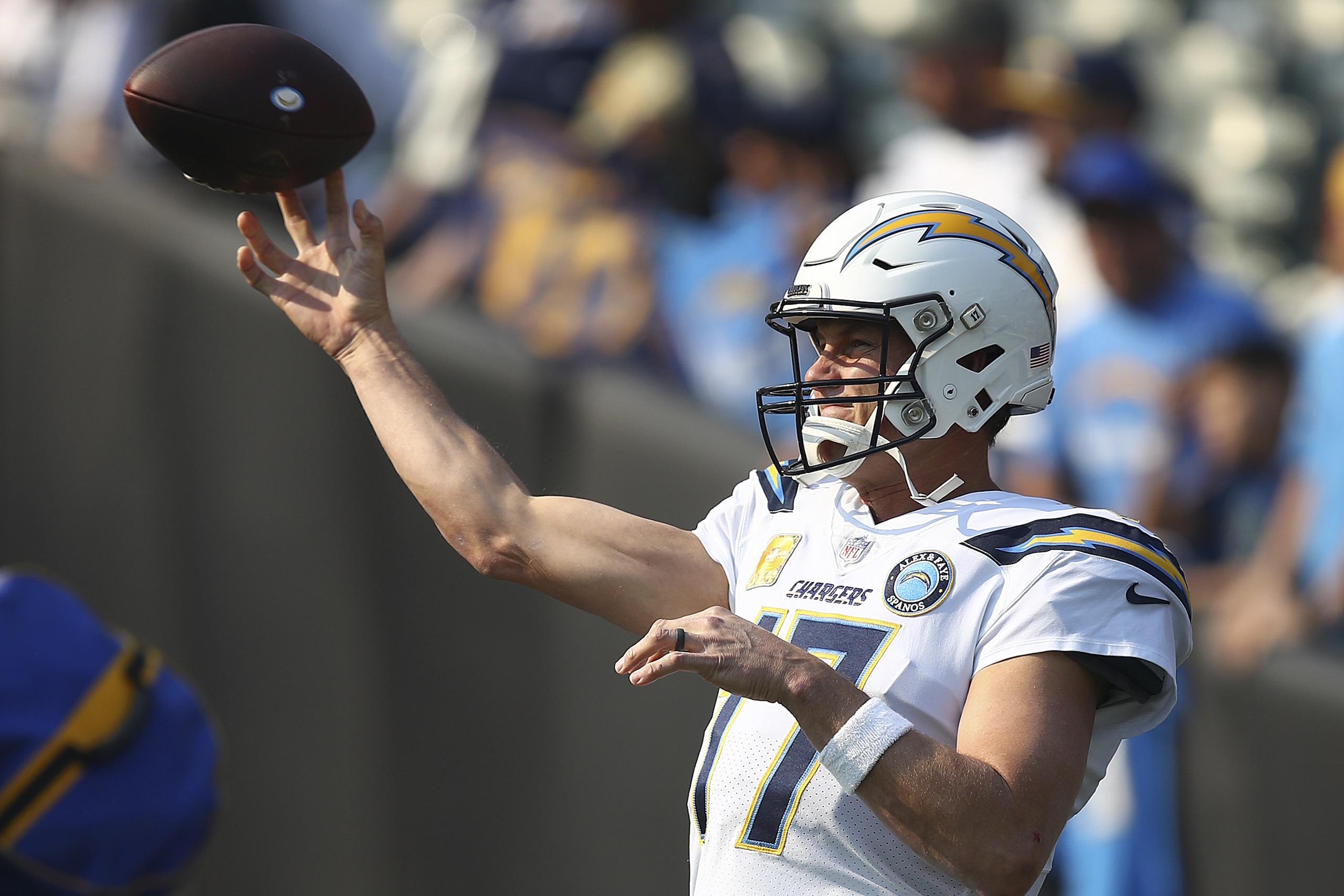 Los Angeles Chargers quarterback Philip Rivers (17) warms up before an NFL football game against the Oakland Raiders in Oakland, Calif., Sunday, Nov. 11, 2018. (AP Photo/Ben Margot)