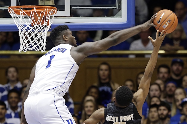 Duke's Zion Williamson,left, blocks a shot by Army's Josh Caldwell, right, during the second half of an NCAA college basketball game in Durham, N.C., Sunday, Nov. 11, 2018. Duke won 94-72. (AP Photo/Gerry Broome)