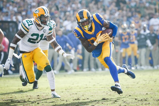 LOS ANGELES, CA - OCTOBER 28: Wide receiver Josh Reynolds #83 of the Los Angeles Rams runs in a pass for a touchdown in the third quarter beside free safety Ha Ha Clinton-Dix #21 of the Green Bay Packers at Los Angeles Memorial Coliseum on October 28, 2018 in Los Angeles, California. (Photo by Joe Robbins/Getty Images)